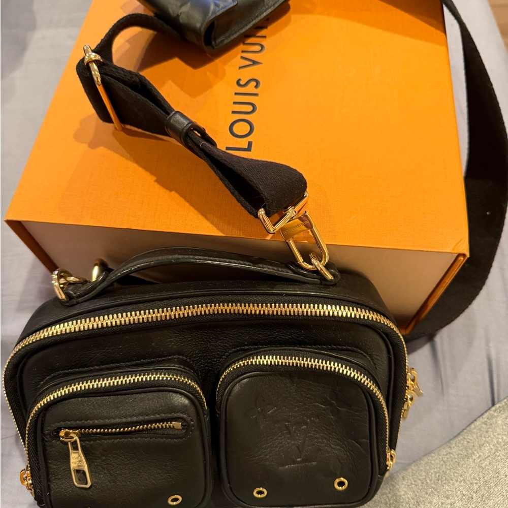 Louis Vuitton Black and Gold women’s messenger bag.